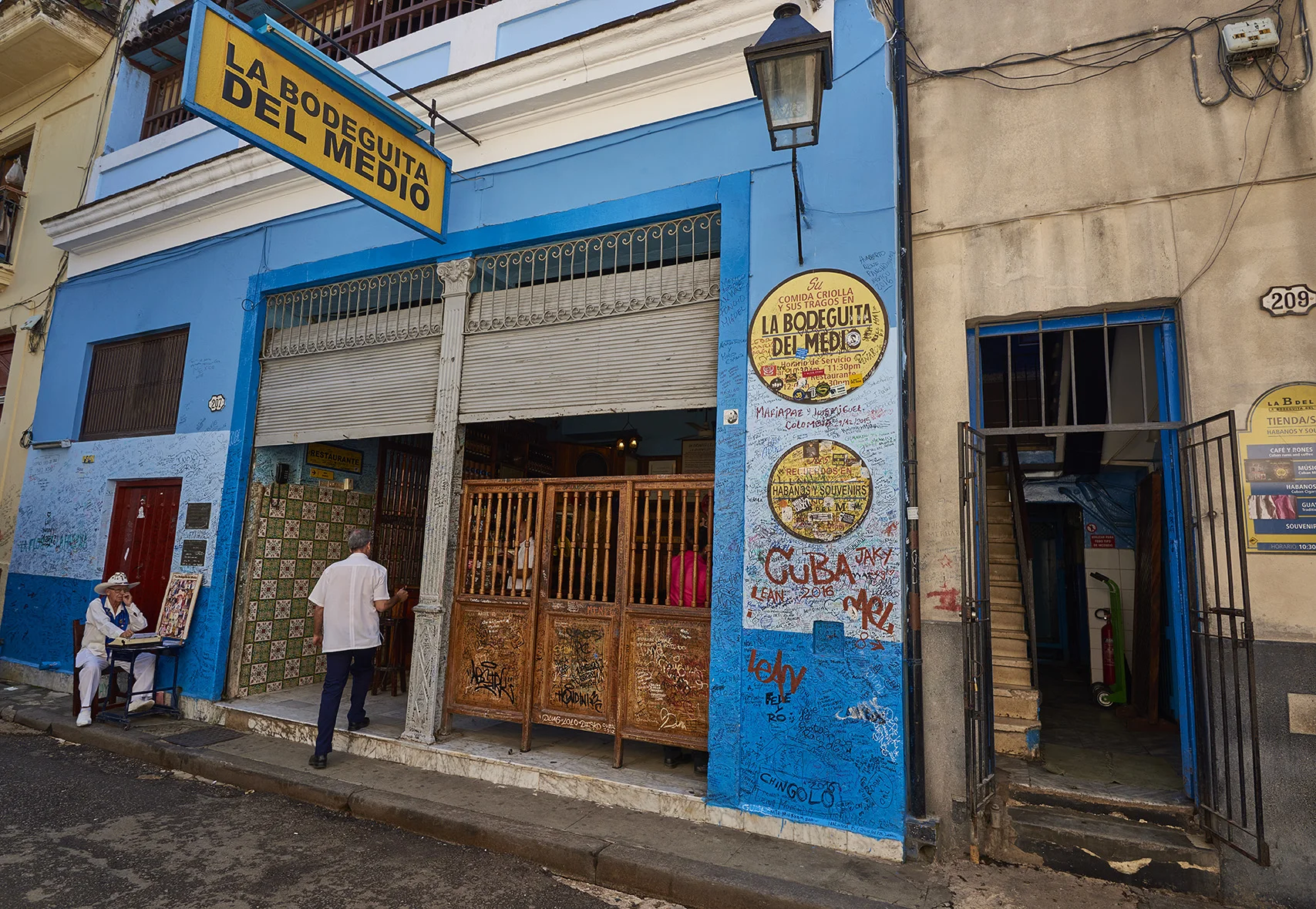 Cuban store front with graffiti in Havana. 