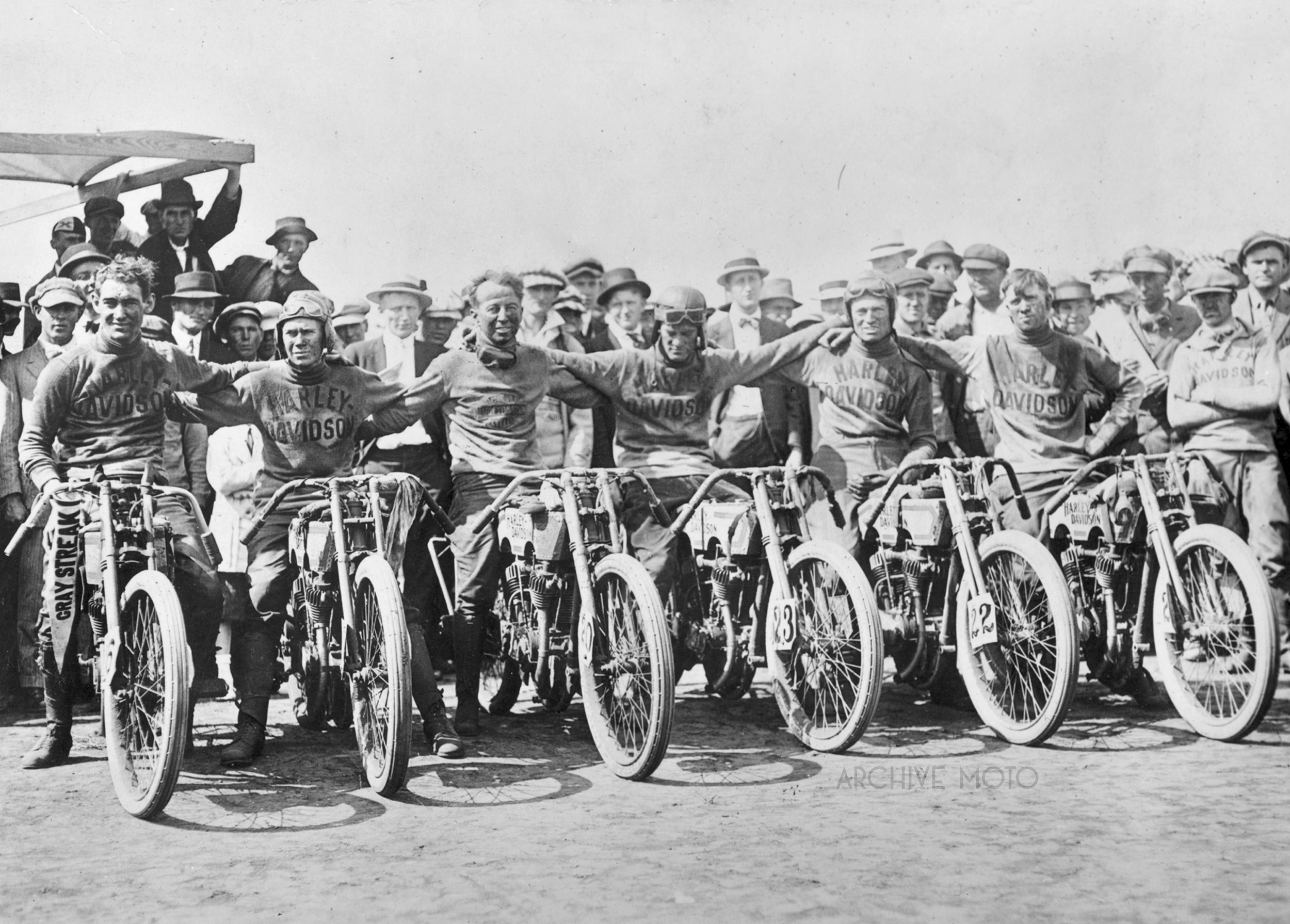 After only a year in the professional racing, the triumphant Harley-Davidson factory team poses onboard their magnificent 11KR’s after a landslide victory at the 1915 Dodge City 300, the preeminent motorcycle race at the time. Left to Right are 1st place finisher Otto Walker, 2nd Harry Crandall, 4th Joe Wolters, 5th Leslie “Red” Parkhurst, 6th Alva Stratton, and 7th Ralph Cooper.