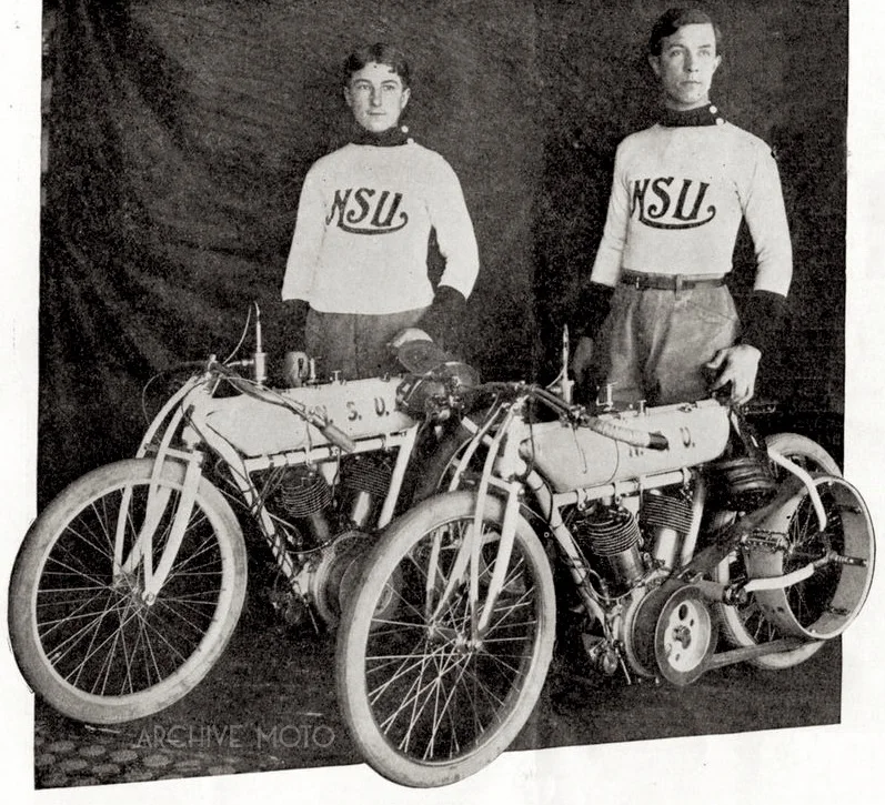 19 year old Morty Graves and 29 year old Arthur Mitchell with their factory NSU racers at the Los Angeles Coliseum, America's first board track motordrome in early Spring, 1909.