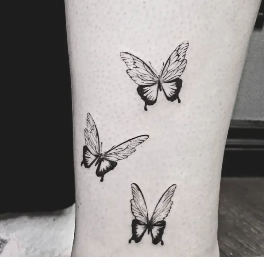 Fine-line-butterflies-tattoo.webp