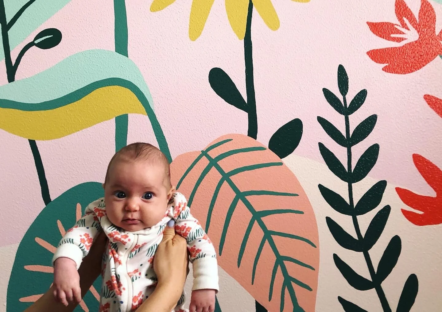 evie with mural.JPG