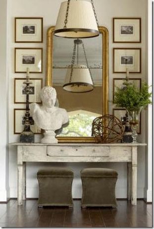 I love to use a centered mirror, with artwork lining both sides, in my design work. Symmetry mixed up with fun accessories. We're about ready to unveil our store, so look forward to that with my next blog! :) -Tiffany