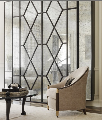 Beautiful modern millwork contrasts the antiqued mirror and sets the stage for the art deco chair. Hollywood glam! 