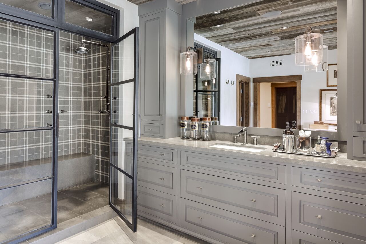 These antique pharmacy bottles help add a sense of masculinity to this master bathroom for the man of the house. The plaid tiled shower helps a little too. :) Collection of Vintage Pharmacy Bottles straight from the antique market available!