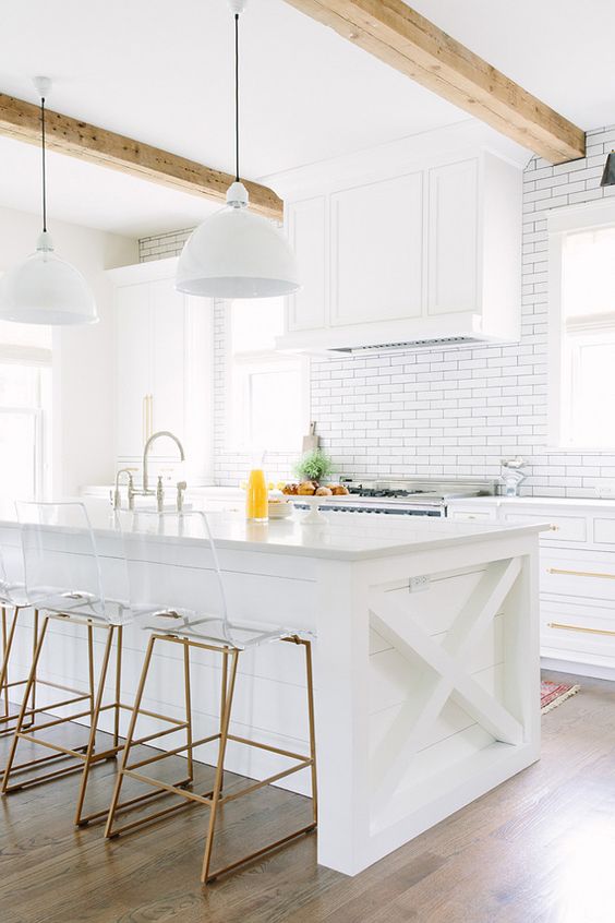 All white kitchen. :) Lucite and brass were made for each other.