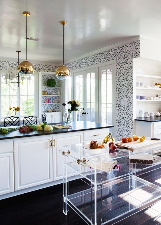 Such a whimsical kitchen. The lucite bar cart fits right in and adds texture without adding weight or color.