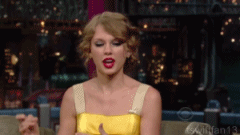 t swift raises hand.gif