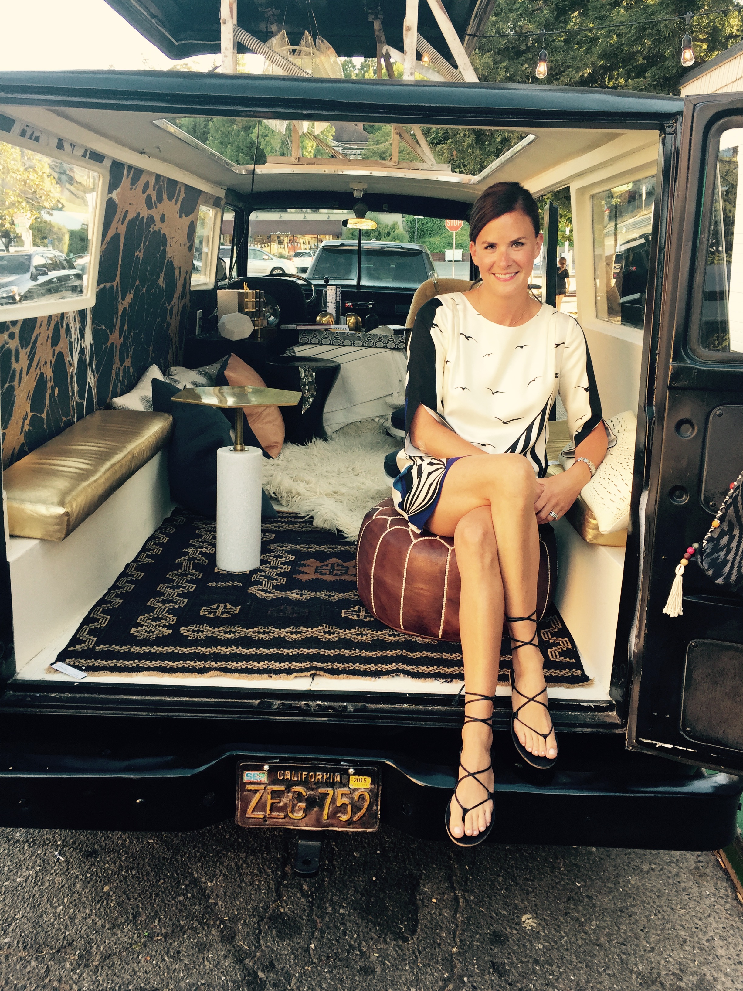 i wore a tibi dress (past season) and madewell sandals . perched in the clubhouse caravan in front of the shop.