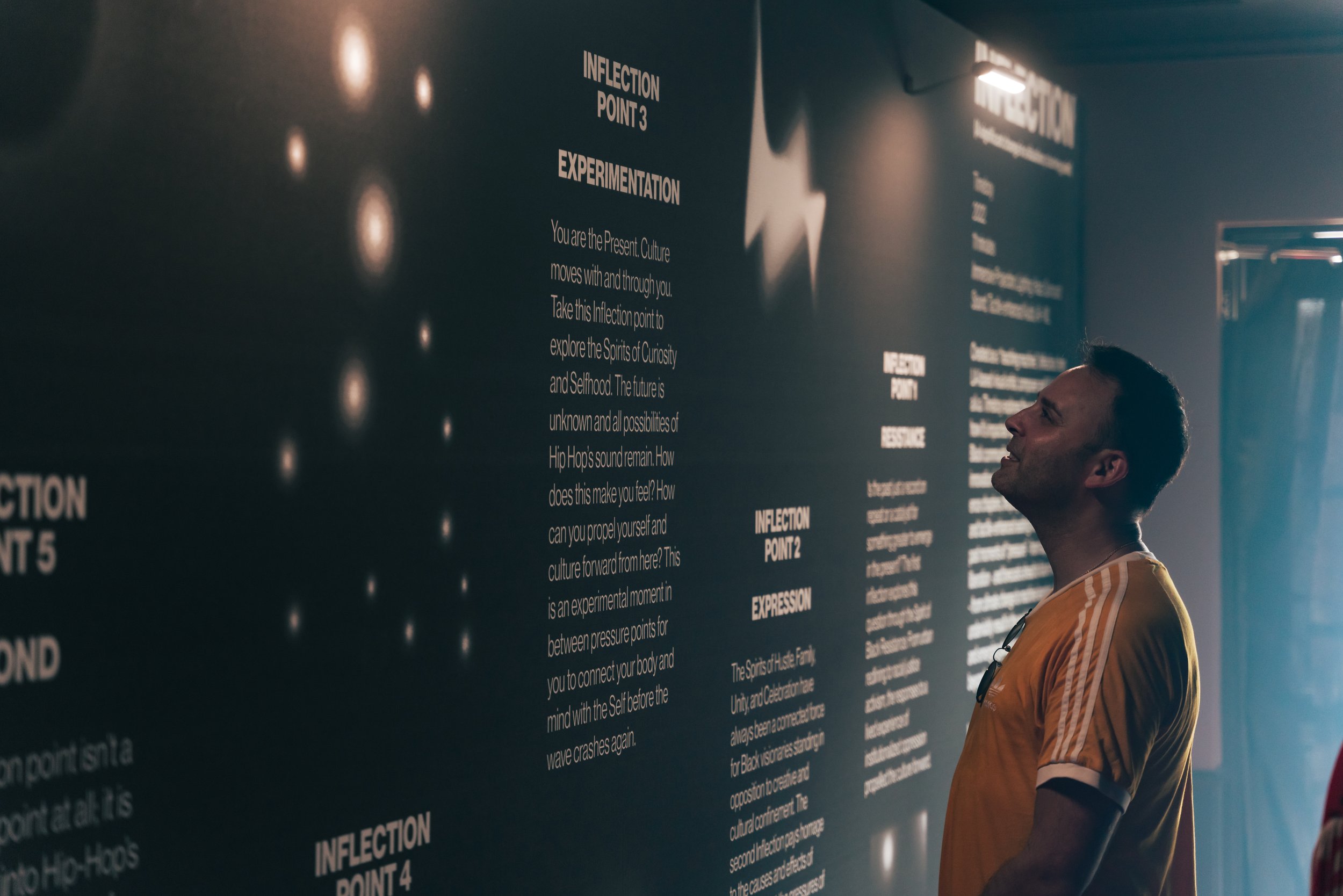  Across five experience chapters, the projection imagery, spatial audio and tactile-enhanced seating of  Inflection  immersed attendees in past moments of “pressure” - from suppression to liberation  - and forecasted ahead to future moments - from cl