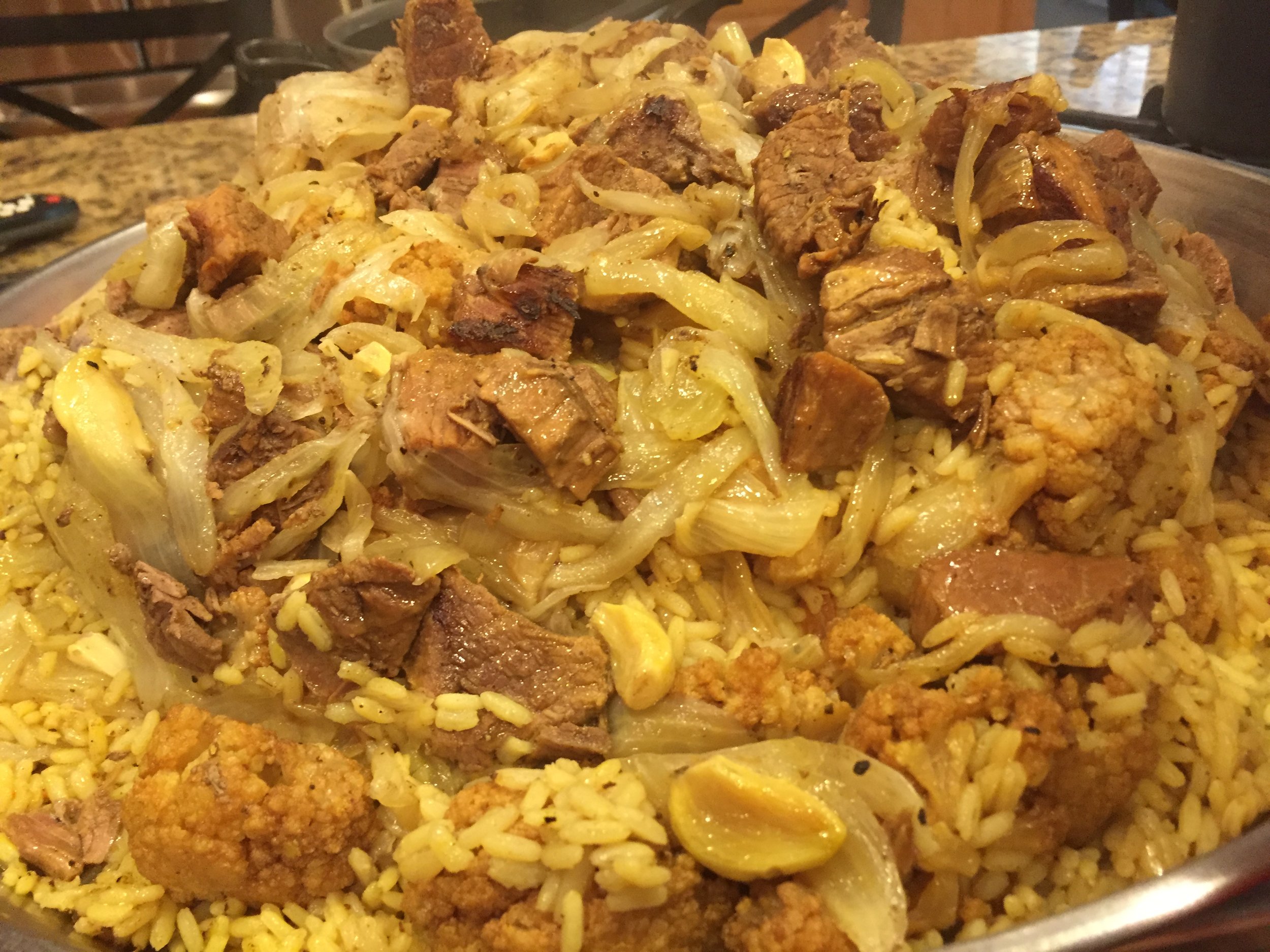 Pictured is Rita’s “Maqluba dish” made of upside-down eggplant, rice, lamb & cauliflower casserole dish. 