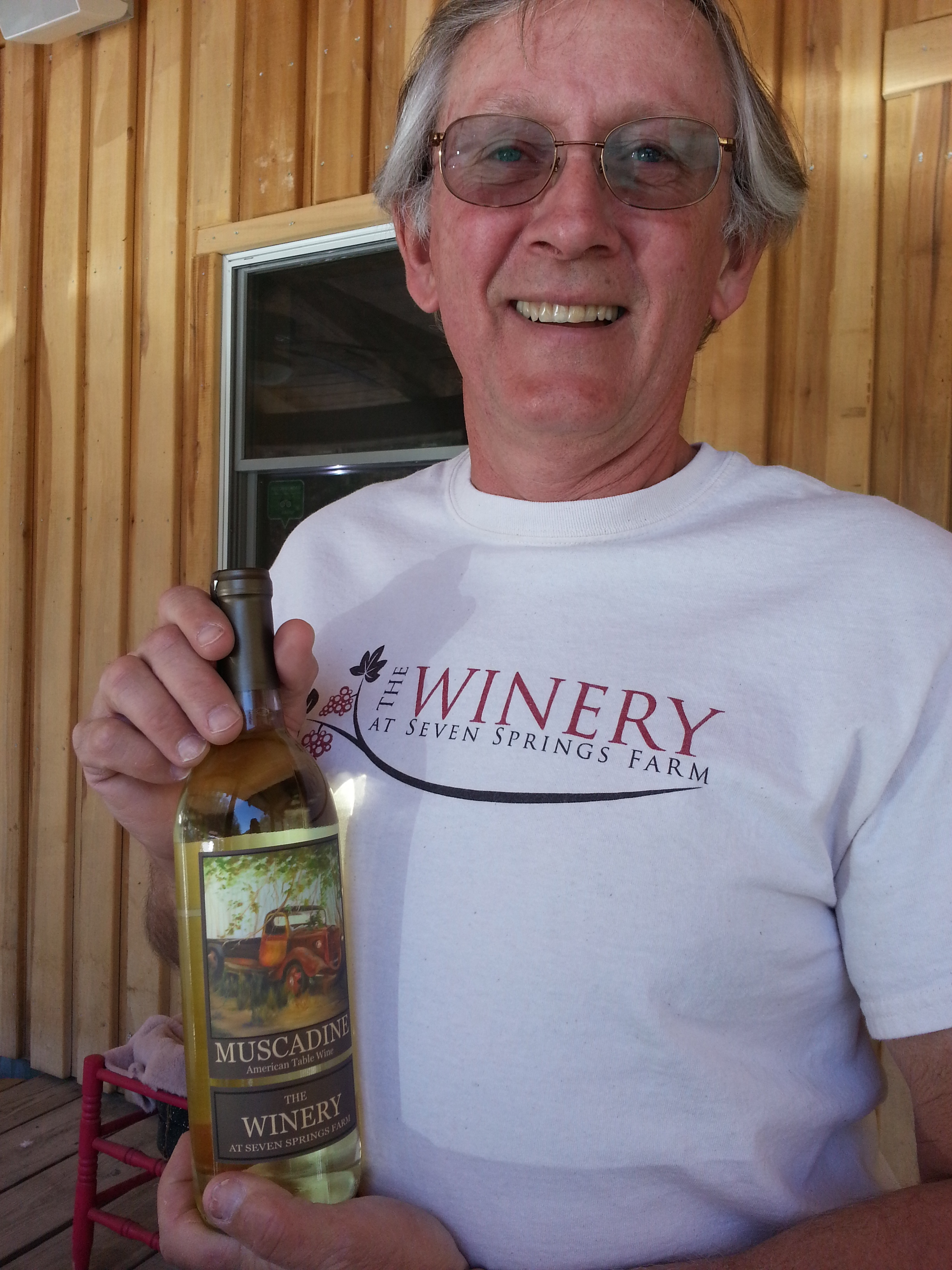 Rick Riddle holding a bottle of the award winning Muscadine wine from The Winery at Seven Springs Farm, Maynardville, TN. https://www.facebook.com/theWineryatsevenspringsfarm/