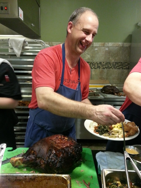 Chef Fleer behind the cafeteria line dishing out his ham and ham sauce at the 2nd Appalachian Food Summit.