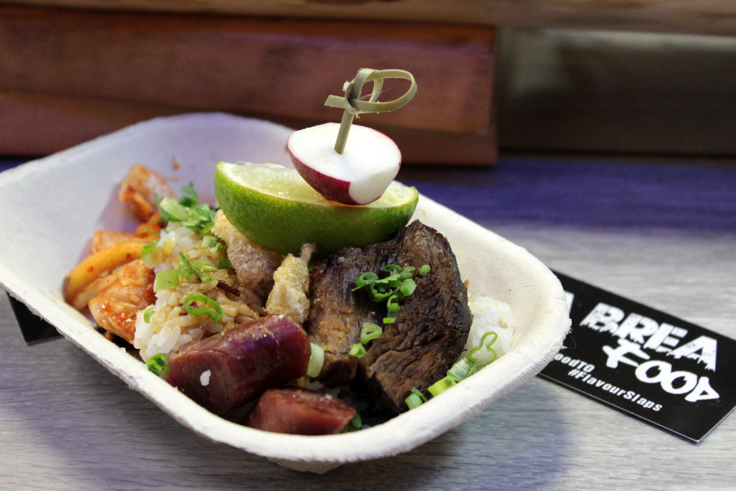 Dos Cerditos Bo Zai Fan - Duo of Lap Cheung & Shoyu Adobada char siu on fragrant rice, radish, lime & chicharron crisps