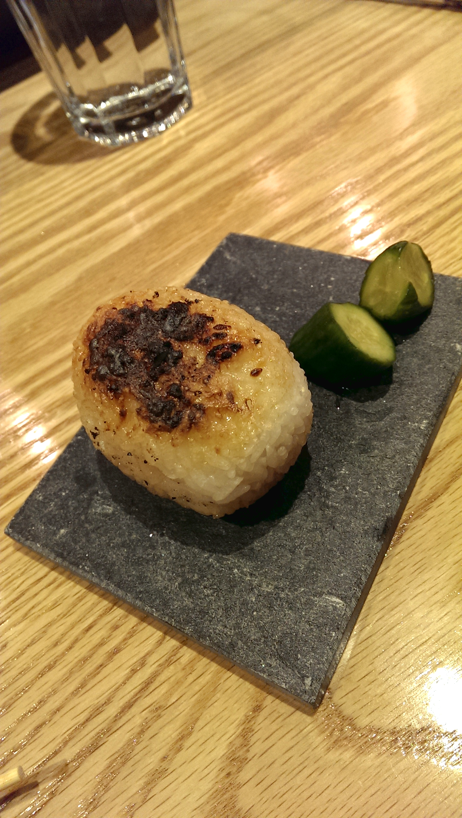 Yakionigiri (bincho charcoal grilled rice ball with a choice of plum or konbu kelp)