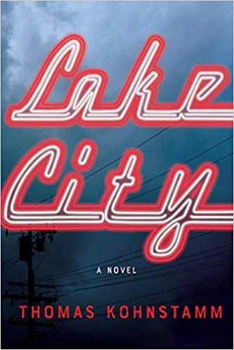 New Book of the Week (January 14, 2019) Lake City by Thomas Kohnstamm It's a few months after 9/11, and Lane Bueche, who has long fancied himself the Bill Clinton of Lake City Way, headed from the nowhere of north Seattle toward an upscale, intellectual life of NGOs and Economist editorials, is right back where he started, slicing turkey at the Fred Meyer deli and drinking Rainier tallboys at his mom's, just off the endless strip of car dealerships and bikini-barista huts. Kohnstamm's debut novel is a love letter of sorts to his old (and current) neighborhood in all its unambitious ugliness, and Lane is the colossal screw-up at its center. It's a messy farce with a sloppy heart, a kind of underbelly, Lesser Seattle companion to Where'd You Go, Bernadette , and pretty much required reading for anyone who cares about where Seattle has been, and is headed. —Tom