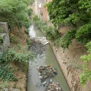 Channels and rivers are used as open sewers. (Photo credit: Joan Rose)