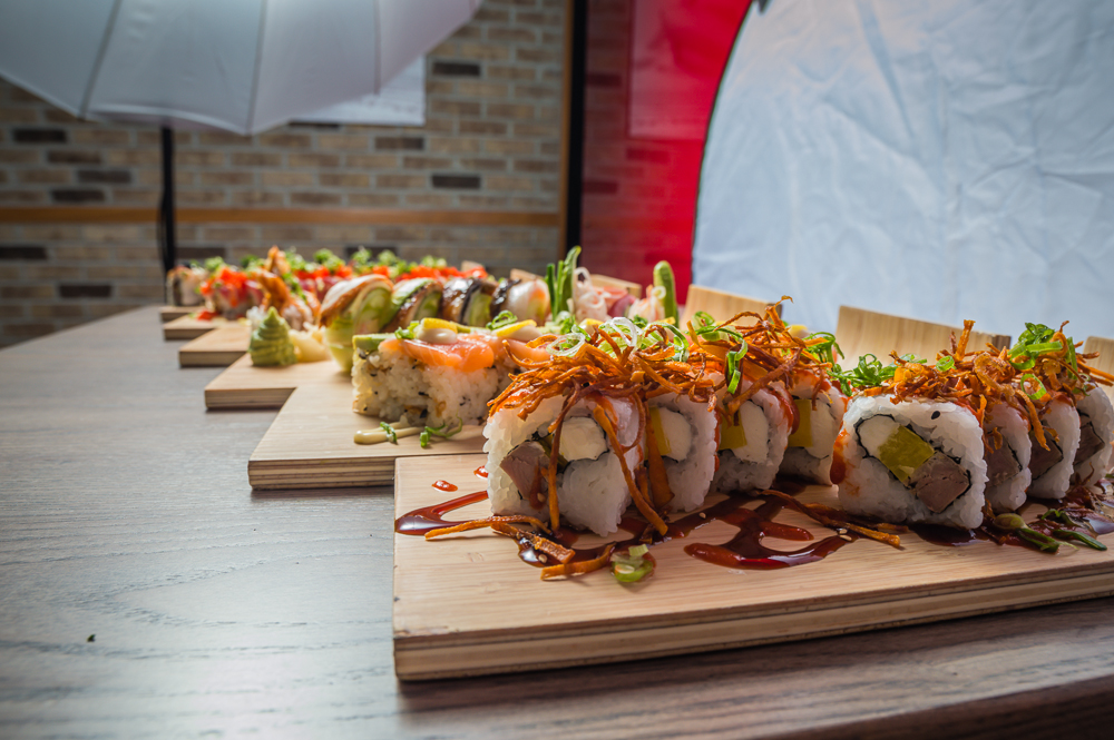 A behind the scenes shot showing the sushi on the table as well as my lighting setup.