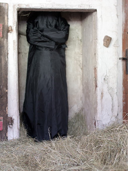 self-portrait in cowshed