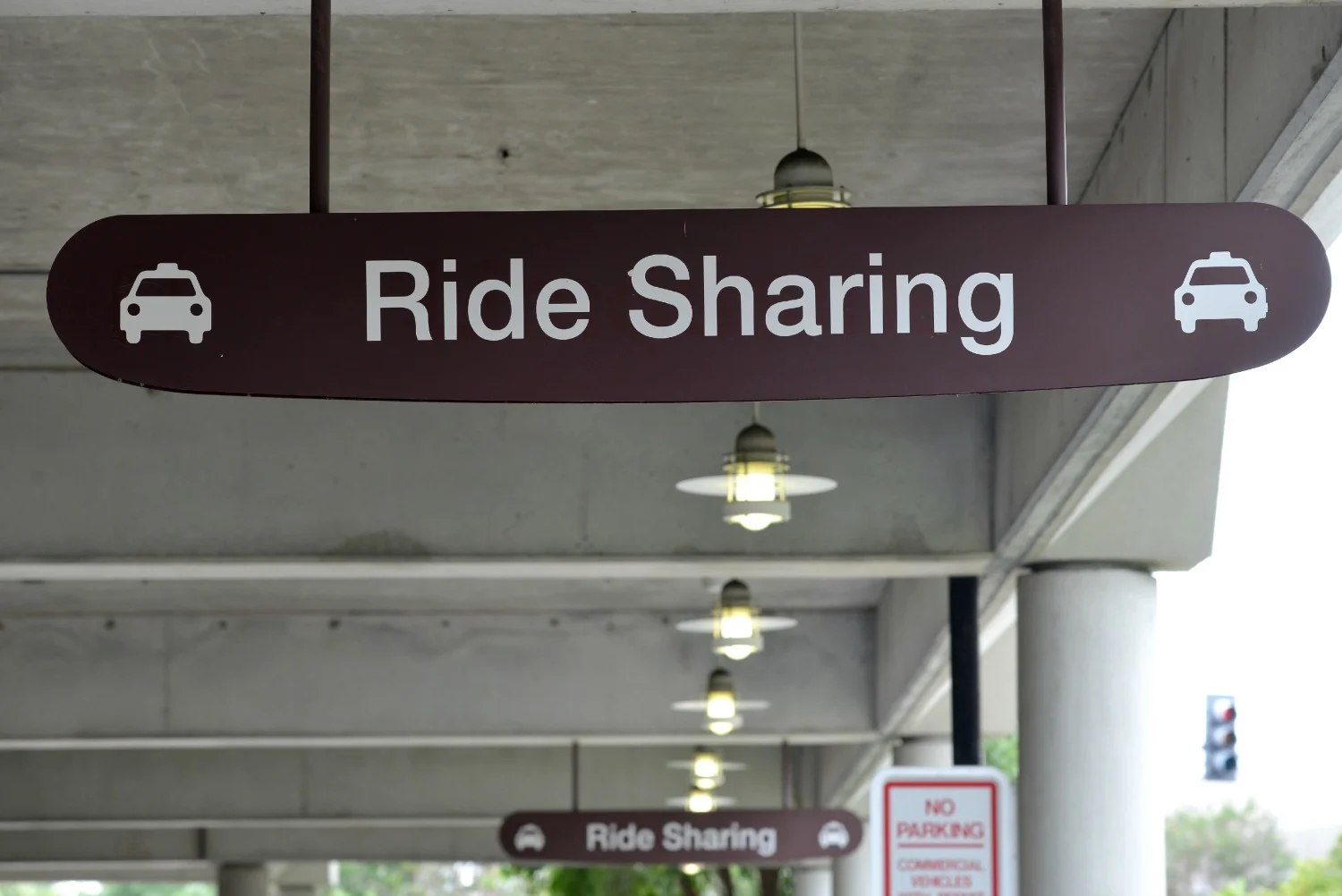 Signs at Nashville International Airport designating the new pickup zone for ridesharing passengers.