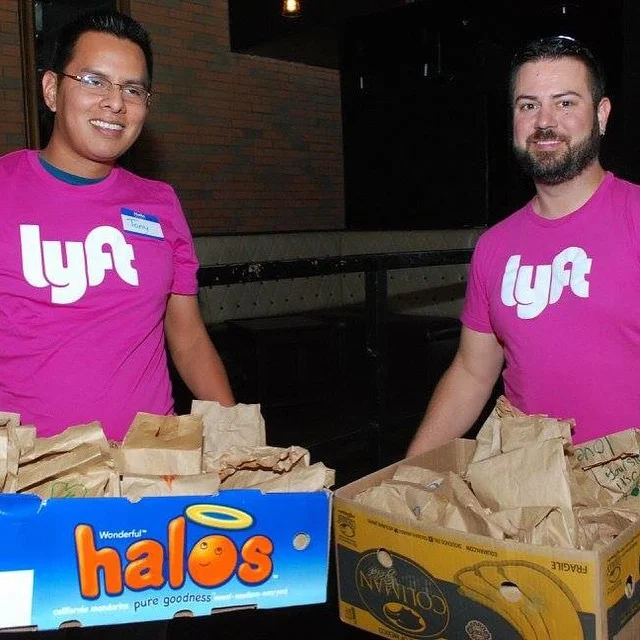 Drivers deliver bagged lunches in Phoenix.