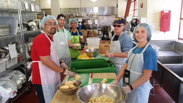 Order up! Drivers take the afternoon to assemble meals for those in need.