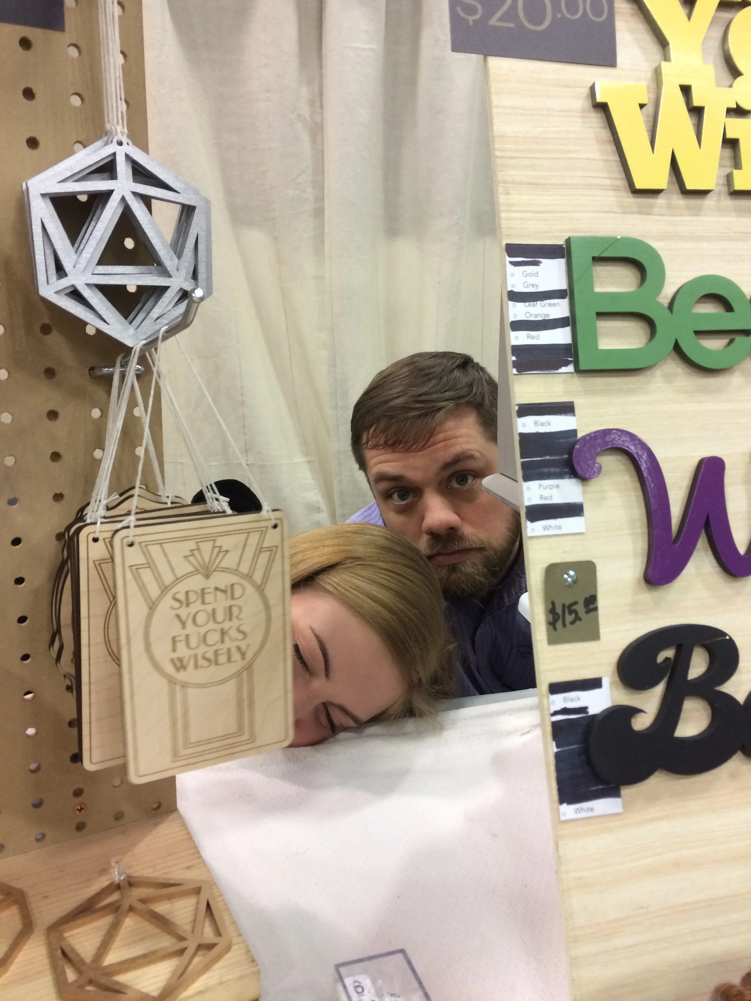 Yes, that is our 13 year old faking a nap in the middle of the show next to our Spend Your Fucks Wisely sign. Don't worry, we teach her lots of other words. Although I feel strongly about about the words of wisdom on that sign. 