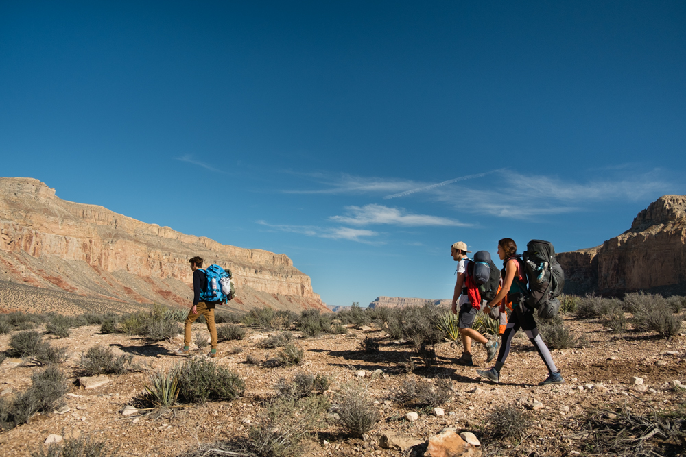 Photo courtesy of Travis Burke of Mikai, Kylor, and I somewhere around hour one before dropping into the canyon.