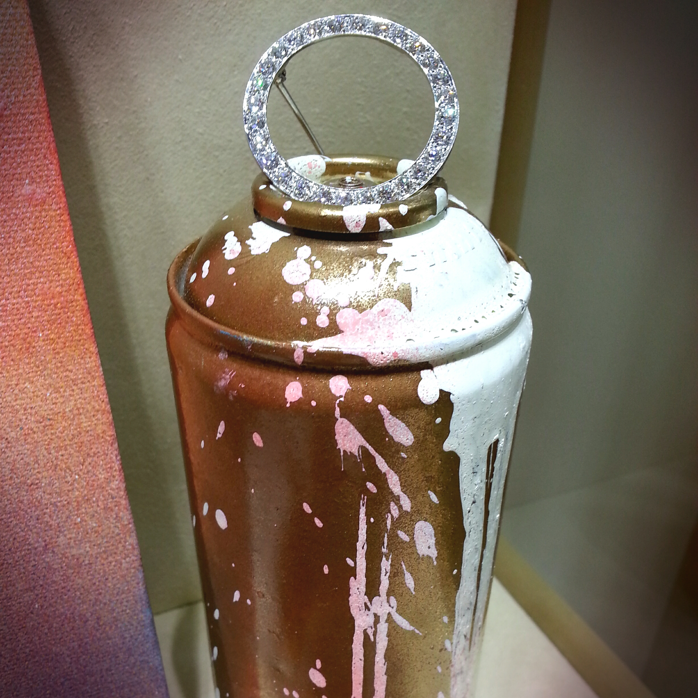 I love this image... the way the gems are balanced on top of the spraycan, well balanced, both literally and visually.