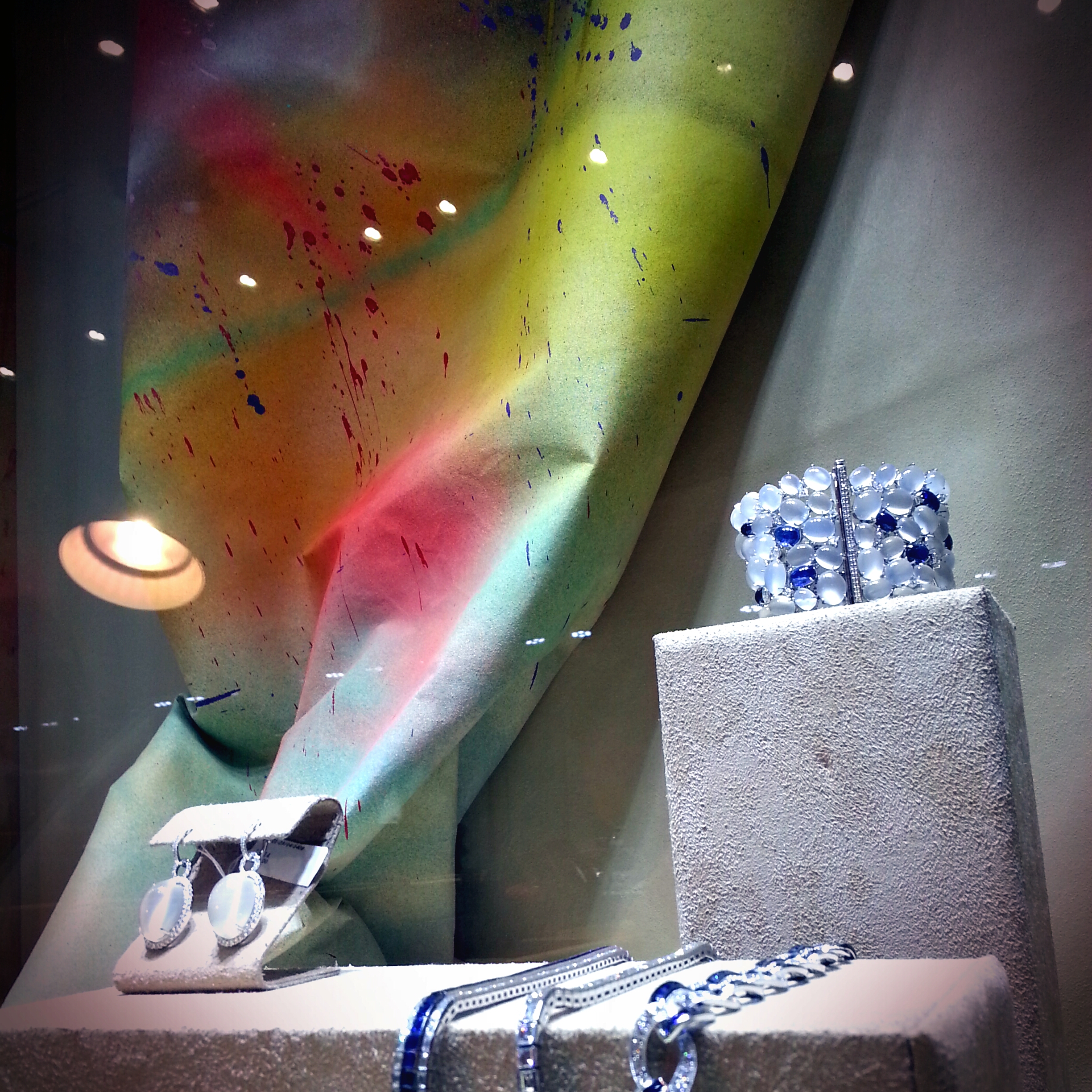 Lots of textures going on here. Love how the colors fold and bend, lots of color and movement swirling around the jewels.