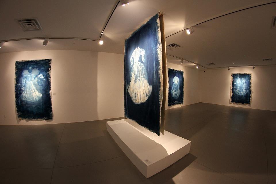 Exhibition in Los Angeles California Museum of Art and Science MOAH - My 8 foot by 10 foot Cyanotypes of vintage edwardian gowns printed on canvas. 1800's antiquarian process of light sensitive chemistry painted onto canvas in darkness and then processed in sunlight until image appears. Then processed. 