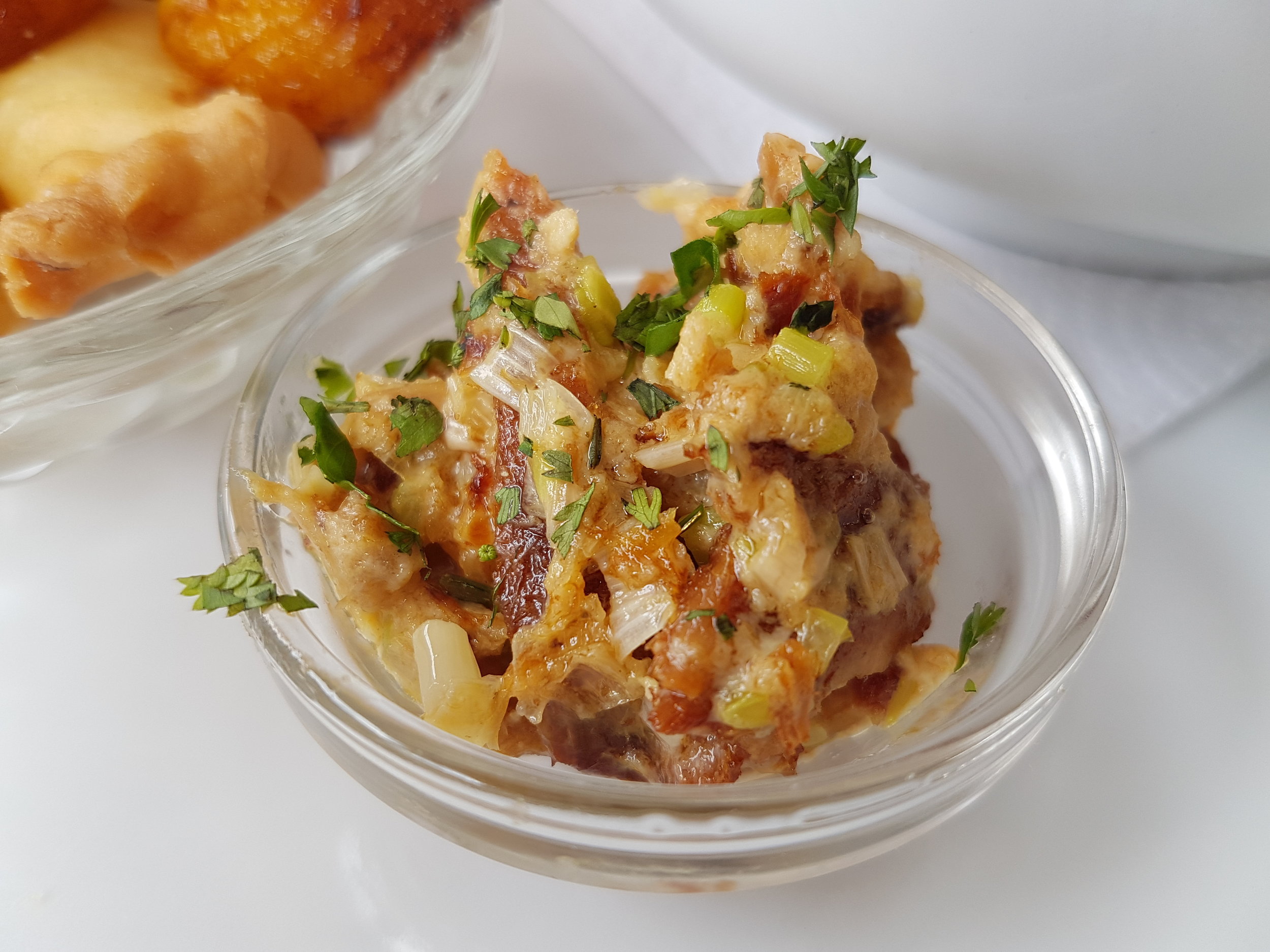 Salt cod fish is cooked in milk and is added to Fanesca soup as its eaten.