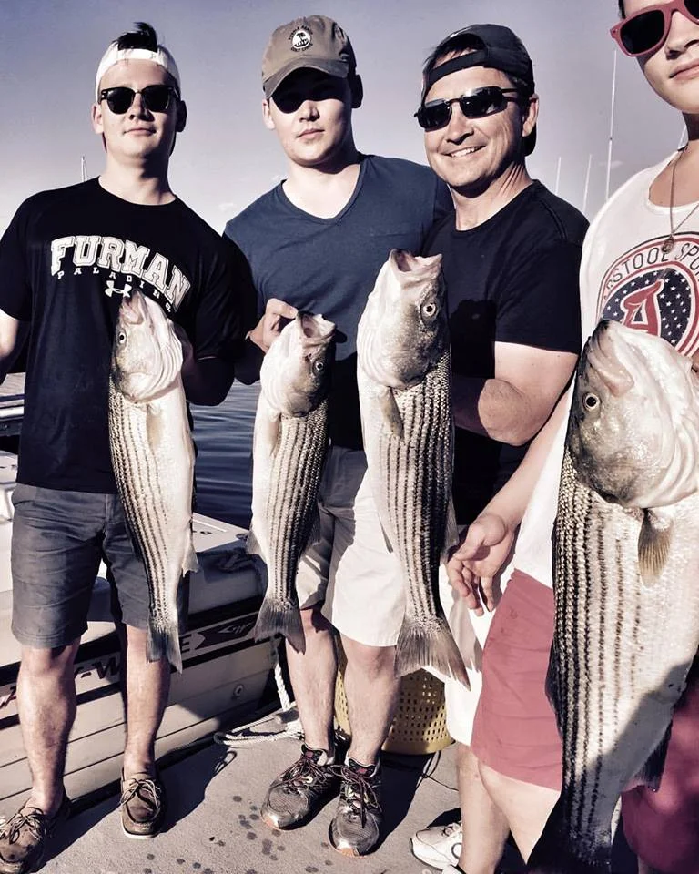 Bob and his sons from Sunday afternoon limiting out on stripers on their Merrimack River Charter!
