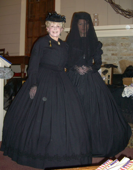 One of the presenters was "The Victorian Lady." Ohmigosh. We all fell in love with her. She came in costume. Here is a picture of her and one of her models in Victorian mourning costumes. The Victorian Lady (and speaker) is on the left. The model is in "deep" mourning. We can tell because of the veil.