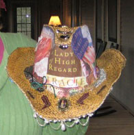 Here's the hat we presented to Tracie. It was decoupaged with some covers from Tracie's books. We each brought a charm to decorate it with. It's because she's such a lady of high regard and we all appreciated the time and effort she went to to make the event happen.