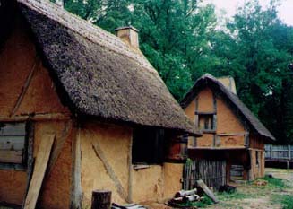   These are wattle-and-daub cottages with thatched roofs.  
