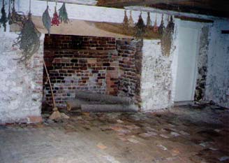   This is the actual basement/kitchen with brick walls and brick flooring, as well as the fireplace where all the cooking for the family would have been done.  