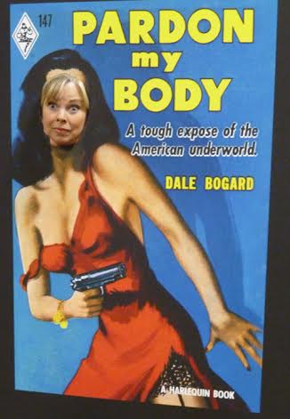 In this one I'm at RomCon and they had a big cardboard replica of a book cover with a hole where the heroine's face went. I got behind it and poked my head through.