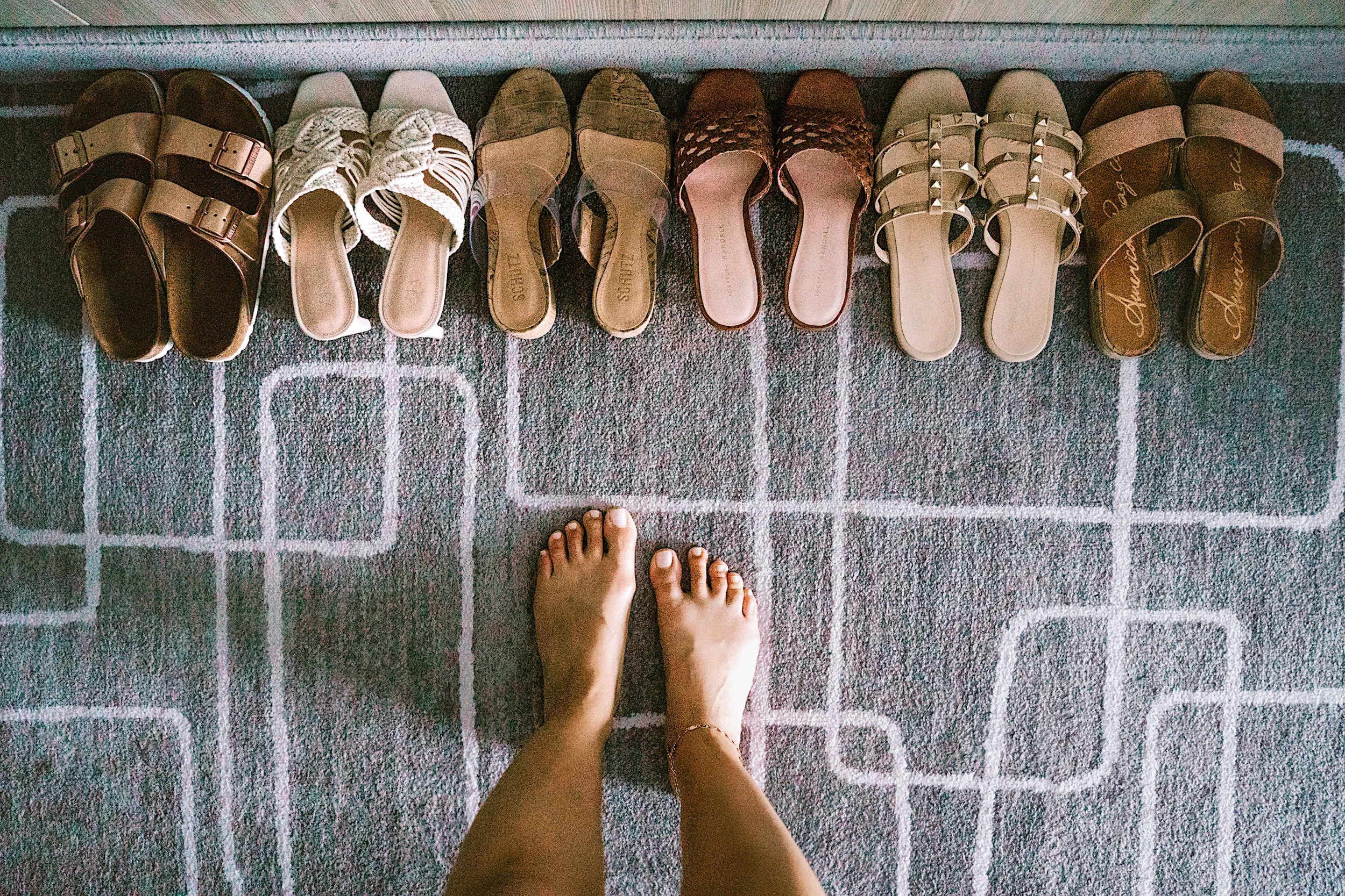 FROM LEFT: BIRKENSTOCK “ARIZONA” SANDAL IN METALLIC COPPER | ZARA HEELED WOVEN WANDALS IN ECRU | SCHUTZ “VICTORIE” SLIDE SANDAL IN TRANSPARENT/NATURAL | LOEFFLER RANDALL “BRETTE” WOVEN CIRCLE SANDALS | VICI “MARCY” STUDDED SANDAL IN NUDE | AMERICAN RAG “EASTEN” SLIDE SANDALS IN ROSE GOLD