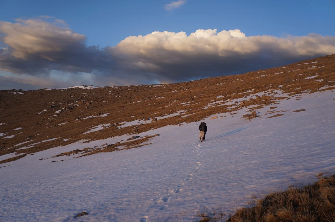 Crossing the snow at sunset