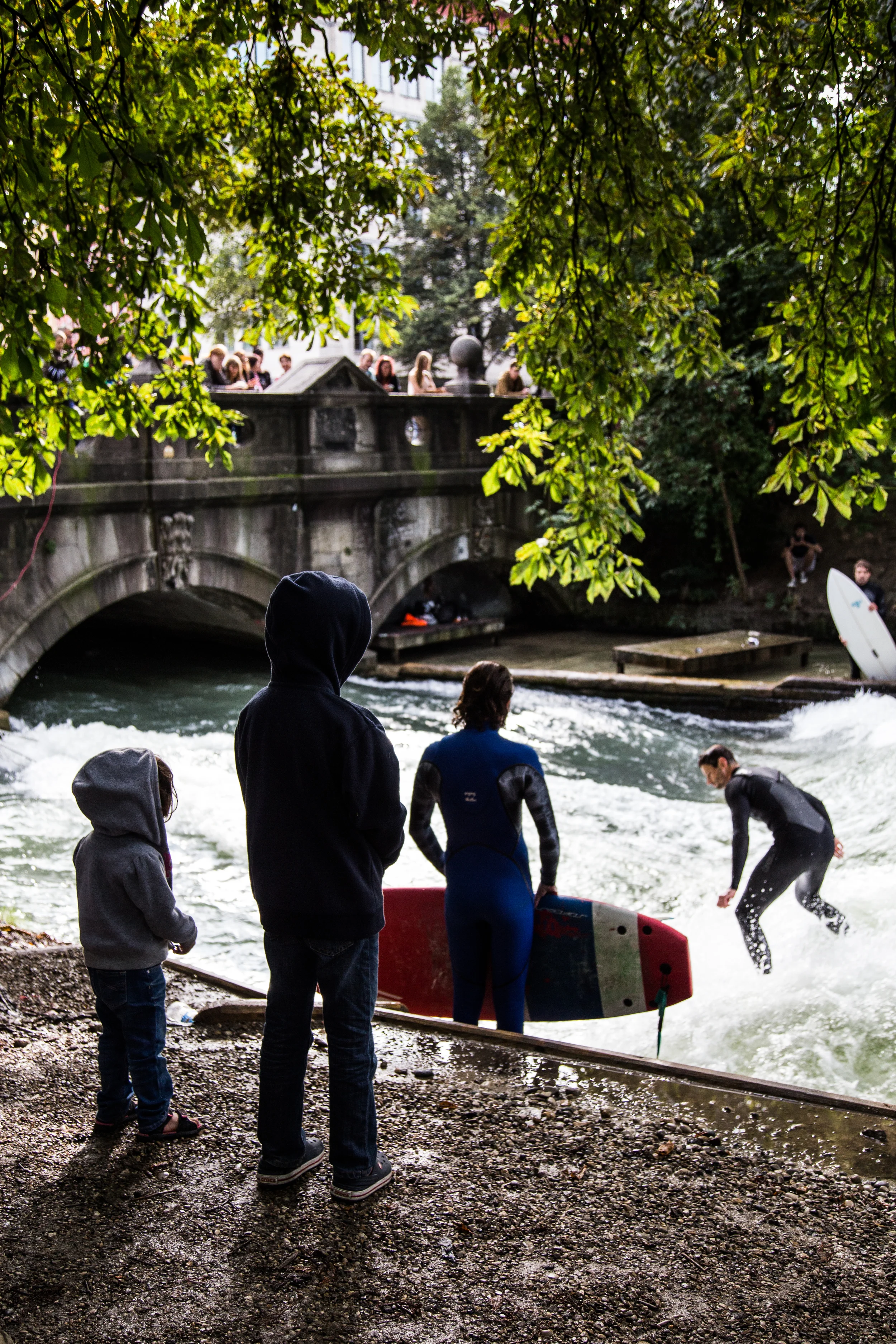 Watching the river surfers. 