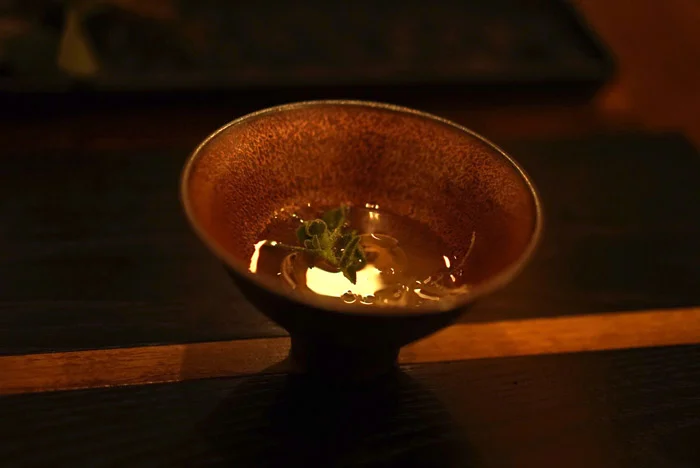 Dashi broth with clams and special crystal weed found on the side of road.