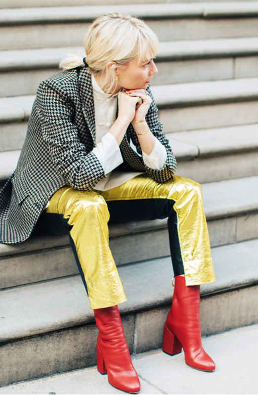 Source WhoWhatWear. Pandora Sykes totally rocking her red mid heel ankle boots with yellow silk trousers and over-sized blazer.