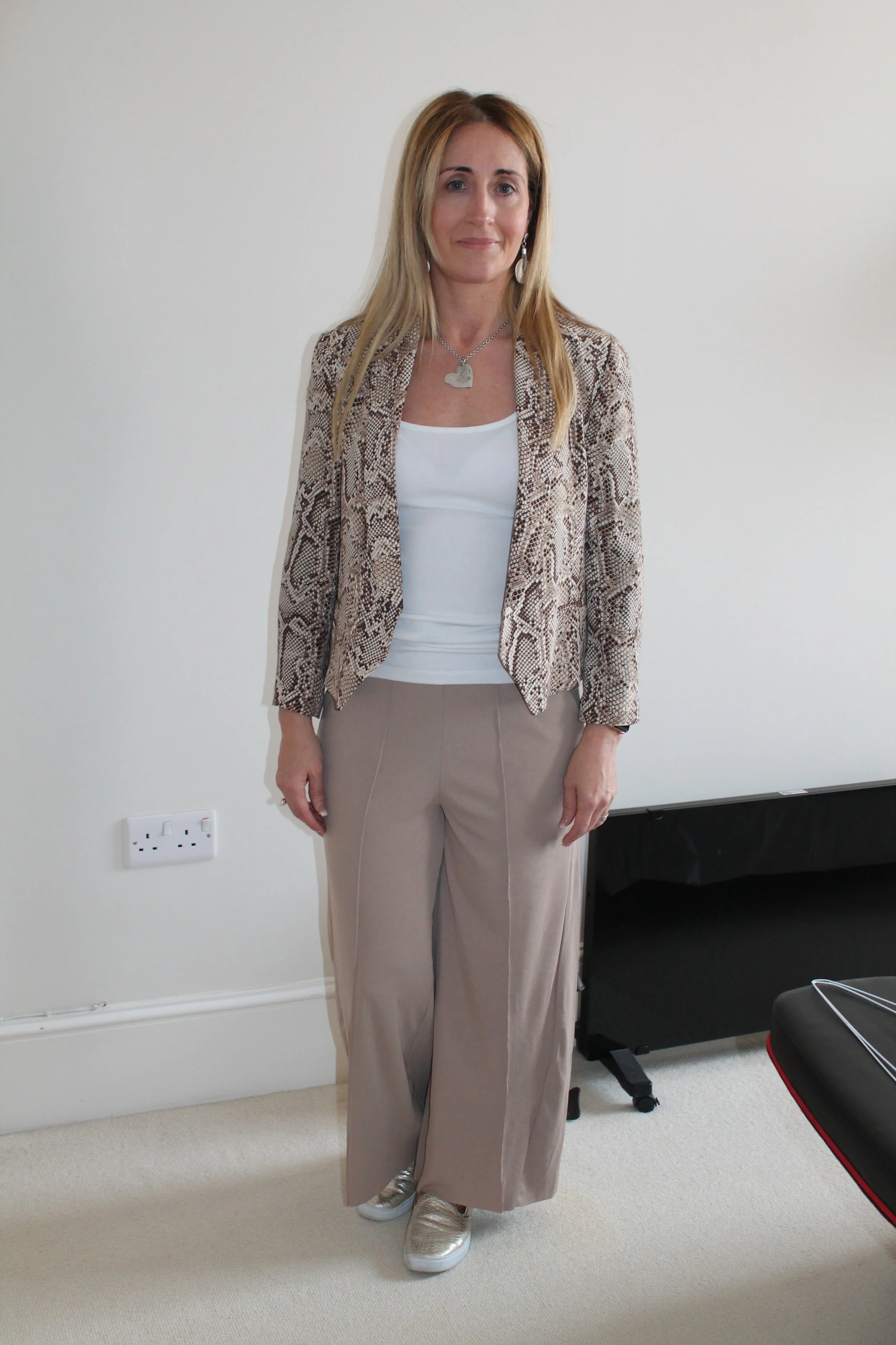 Casual trousers and a vest are given a lift with a printed snake print jacket - great for a weekend
