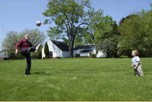  Horst playing soccer with grandson, 2006.