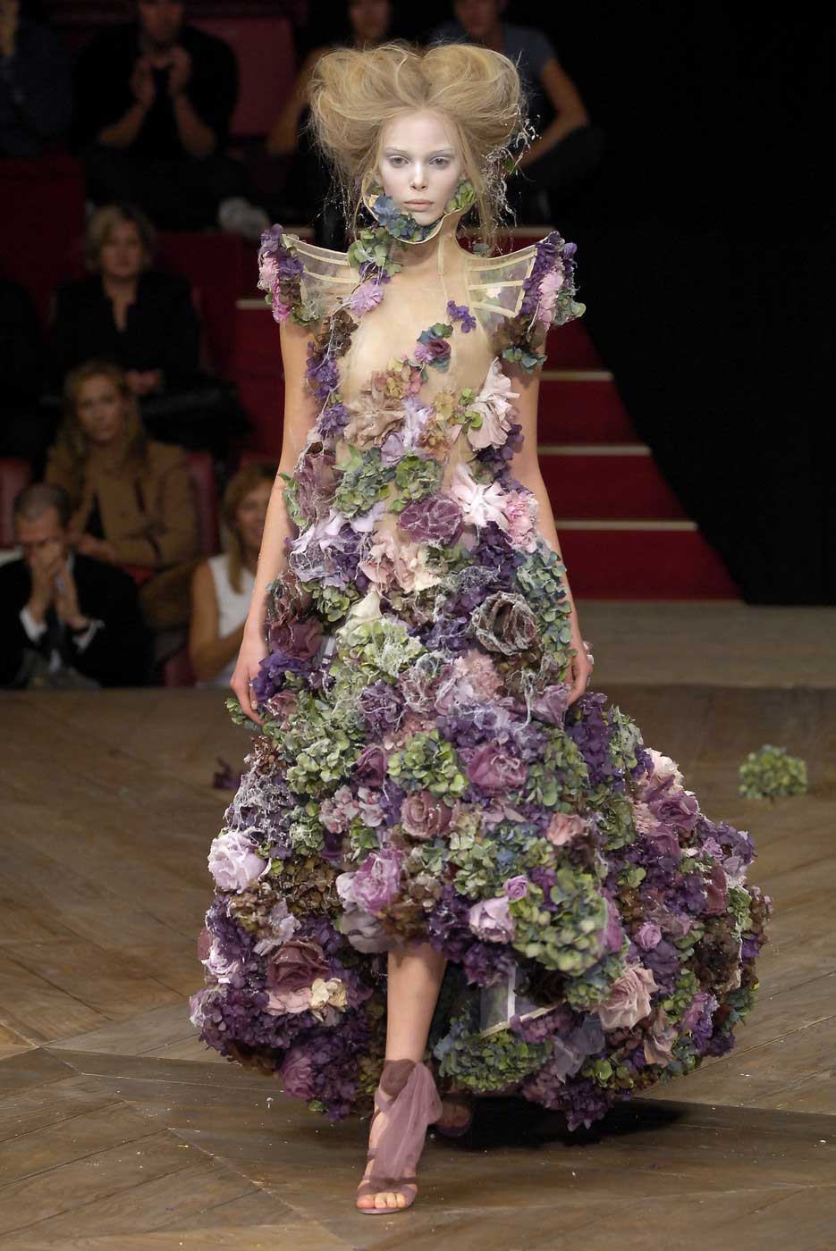 Tania Dzyagileva wearing Alexander McQueen dress made of frozen flowers from the "Sarabande" Spring Collection (image: fashionbylove.com).&nbsp;&nbsp;Notice the felled and lost foliage in the background! Maybe a small cutting garden?