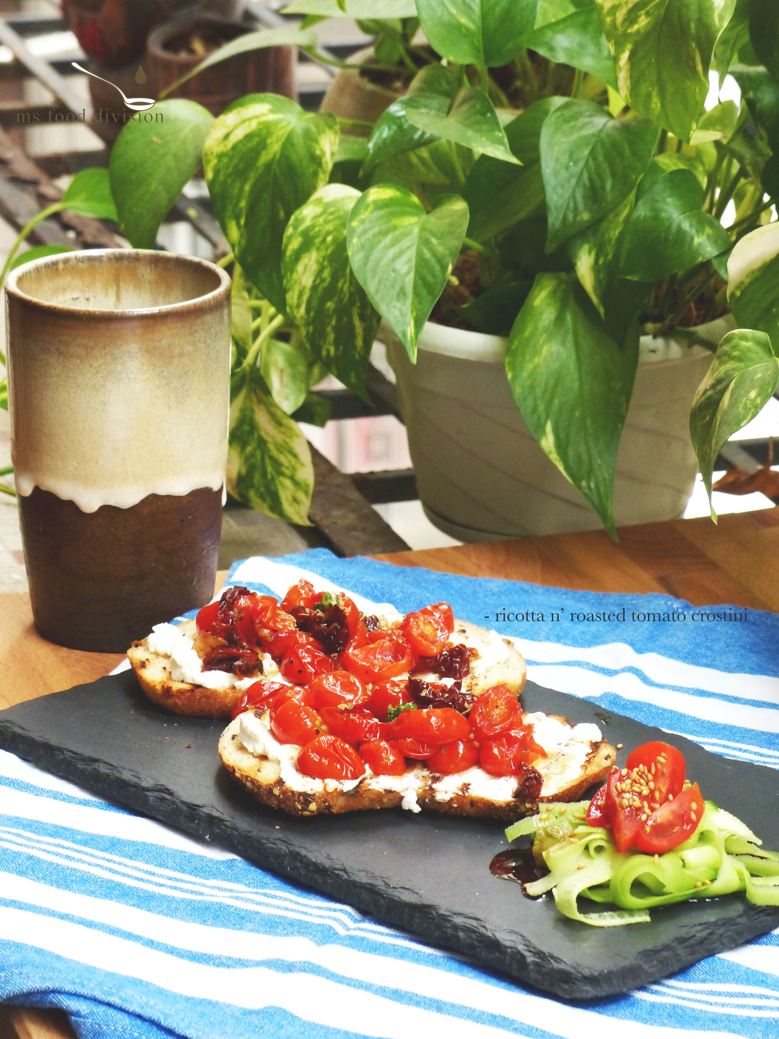 Ingredients: (for 2 servings) 2 slices grilled/baked thin baguette * 100g cherry tomatoes, halved 2-3 tbsp ricotta 1-2 tbsp honey 2 pieces sun-dried tomatoes, thinly sliced 1 garlic, finely chopped extra-virgin olive oil 1 tsp dried oregano Instructions: 1) Preheat oven at 180ºC 2) Place the halved cherry tomatoes with oil, season, bake for 10-15 minutes 3) Preheat a stir fry pan with olive oil, add garlic and sun dried tomato under medium low heat; stir and let cook for 3-5 minutes until the sun-dried tomatoes look a little crispy. Turn off the fire. 4) Transfer the sun-dried tomatoes to the baking dish of cherry tomatoes and bake for around 5 minutes. 5) Spread the ricotta cheese generously on the grilled baguette surface. Add honey on the cheese. 6) Top with the roasted tomatoes and oregano. And ready to serve! :) * I usually like to use a griddle pan to toast my baguettes (I love those little burnt lines on my bread) but feel free to use an oven if you desire. 