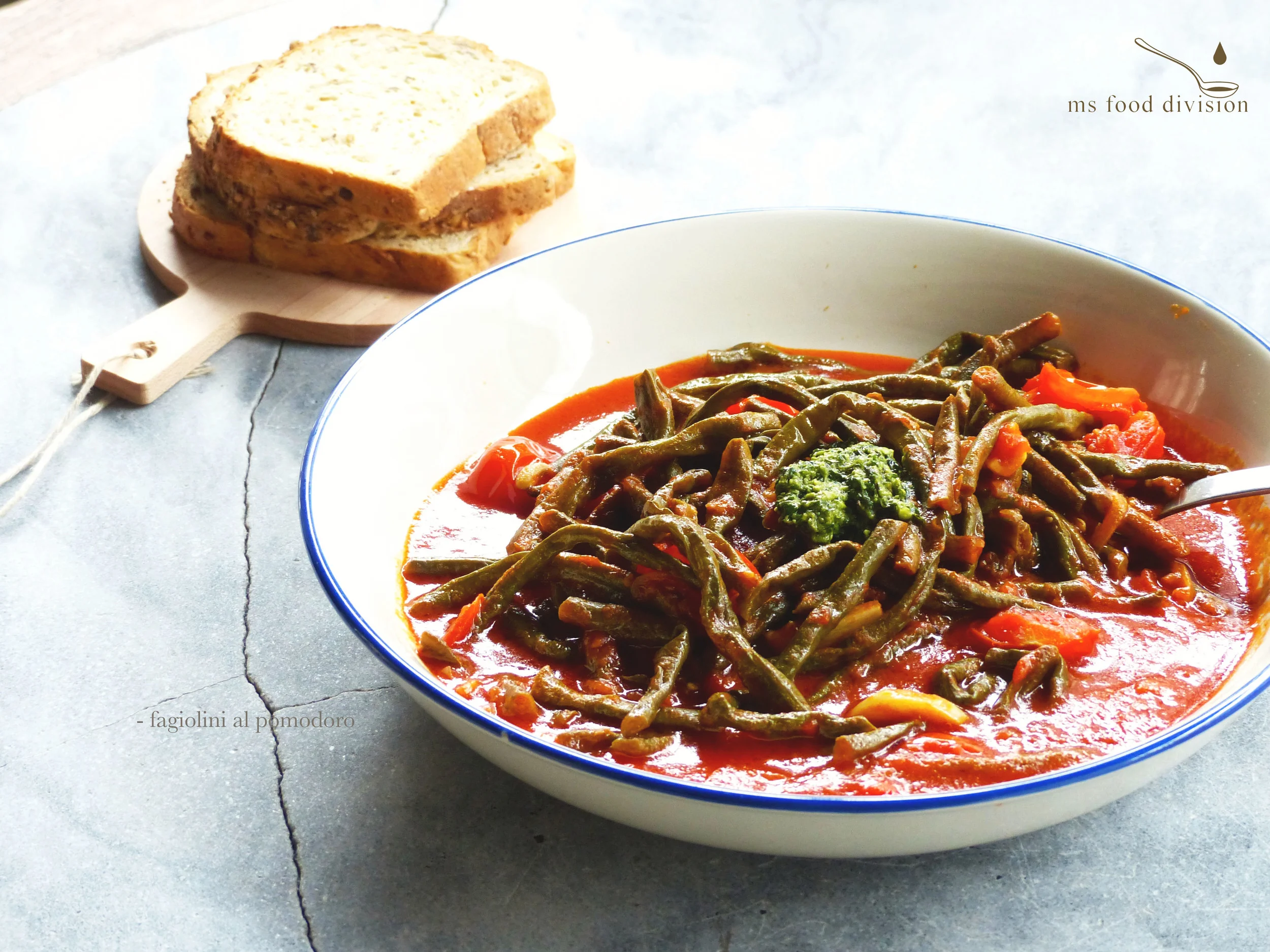 Instructions: 1) Preheat a saucepan with oil on medium low heat, add beans and stir fry for 3 minutes. 2) Add garlic, cherry tomatoes, and shallots, stir and cook for 3 minutes. Add vinegar, cook for 1 minute. Add wine and heat on medium high until the alcohol evaporates. Keep stirring to avoid burning. 3) Add tomato paste and vegetable stock, stir and put a lid on. Bring to boil for 3-5 minutes then reduce heat to medium low and let it simmer for 25-30 minutes until the beans are softened. 4) Add sugar and season according to your taste. Ready to serve. BTW, I added a spoonful of pesto for more taste. 