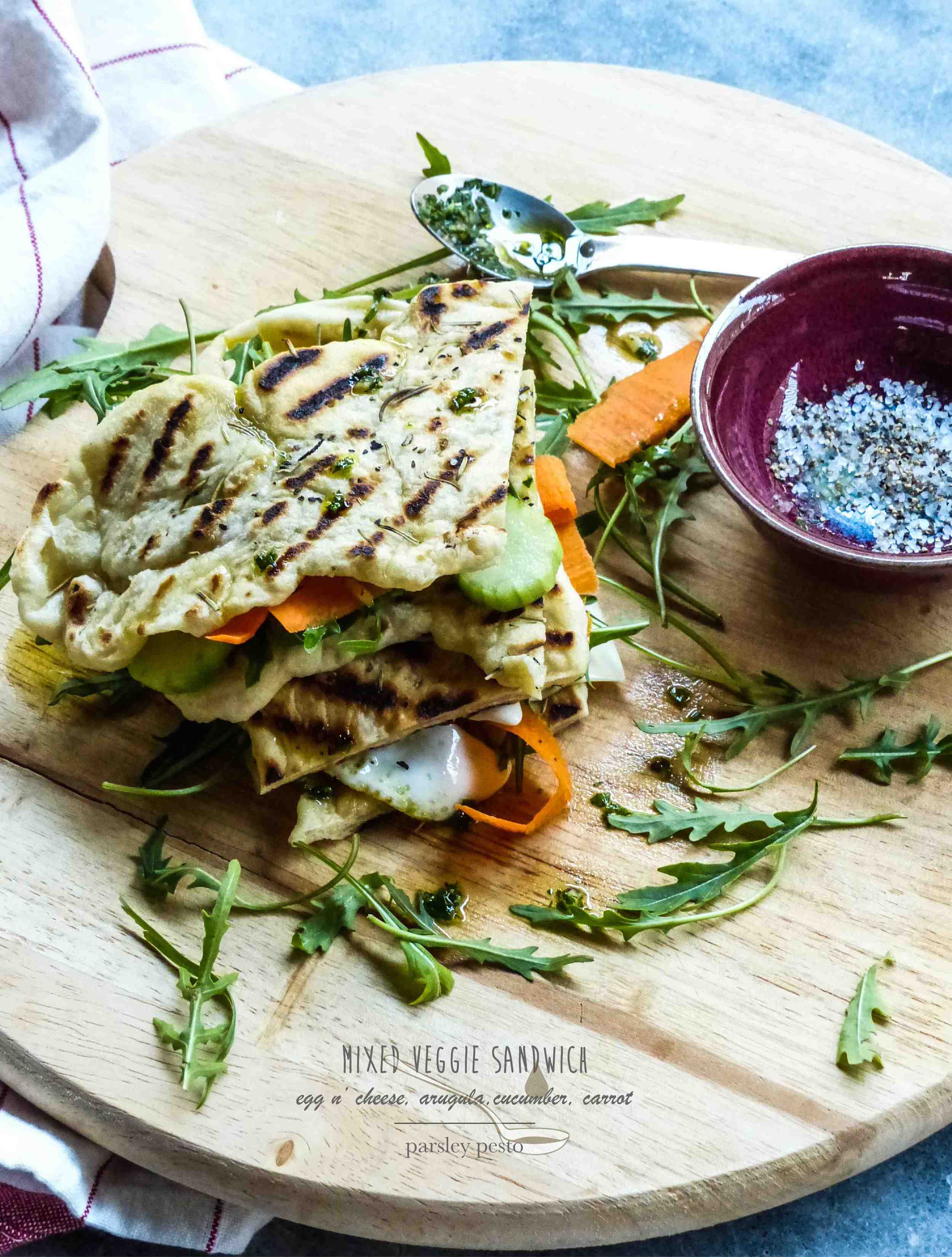 Here is the recipe for the grilled flatbread only: Servings: 6-8 palm size flatbread Preparation Time: 10-15 minutes Cooking Time: 15 minutes for the entire batch Ingredients: 3 cups bread flour 1 tsp yeast 1 tsp salt 1 1/4 cups warm water 1/4 cup extra-virgin olive oil + 2-3 tbsp extra for brushing the dough 1 tbsp sea salt for finishing 2 tbsp dry rosemary leaves for finishing Instructions: 1) Get a large bowl, whisk the flour and combine with salt and yeast. Mix well. 2) Make a well in the center, pour water and oil. Mix together with a wooden spoon in a circular motion until the mixture turns to a dough mass. 3) Spread a half handful of flour on a work surface, start to knead the dough until it turns to a smooth ball. This took around 5-7 minutes. Spread a little more flour if the surface gets dry up and the dough starts sticking to the surface. 4) Add a drizzle of oil to the large bowl, put the dough back in and cover the bowl with a plastic wrap or damp kitchen towel. Place the bowl at a warm place and let the dough rise for about 30-40 minutes. I left it at my balcony because it is quite warm during the day here in Hong Kong. 5) After the dough is ready, divide the dough into 6-8 flatbread (flatten/stretch each smaller dough to whatever shape you like) and sprinkle a bit of rosemary on top. 6) Preheat a grill pan with a little oil on medium heat, start grilling each flatbread. Each takes about 3-5 minutes. Sprinkle a little bit of sea salt before serving. 