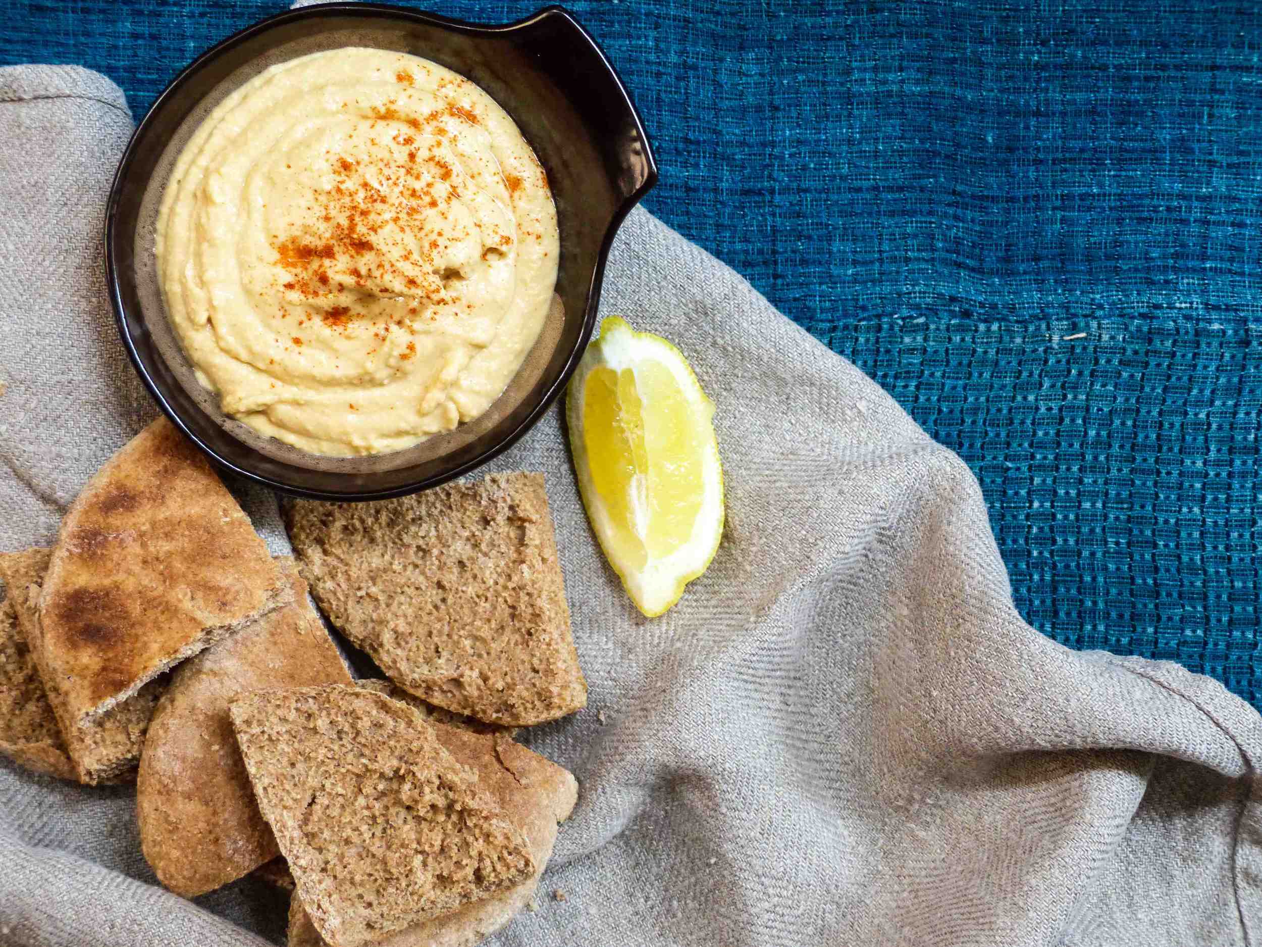 Hummus and pita - the perfect combination :) Ingredients: 1 can chickpea, drained, rinsed, and skin removed 1 garlic clove 1 tsp cumin 1 tsp paprika 2-3 tbsp creamy peanut butter 3-4 tbsp greek yogurt 3-4 tbsp extra virgin olive oil 1/2 fresh lemon juice Instructions: 1) Put everything into a food processor. Blend until smooth. Add more yogurt and oil if the texture is too thick. Adjust to your taste preference. 