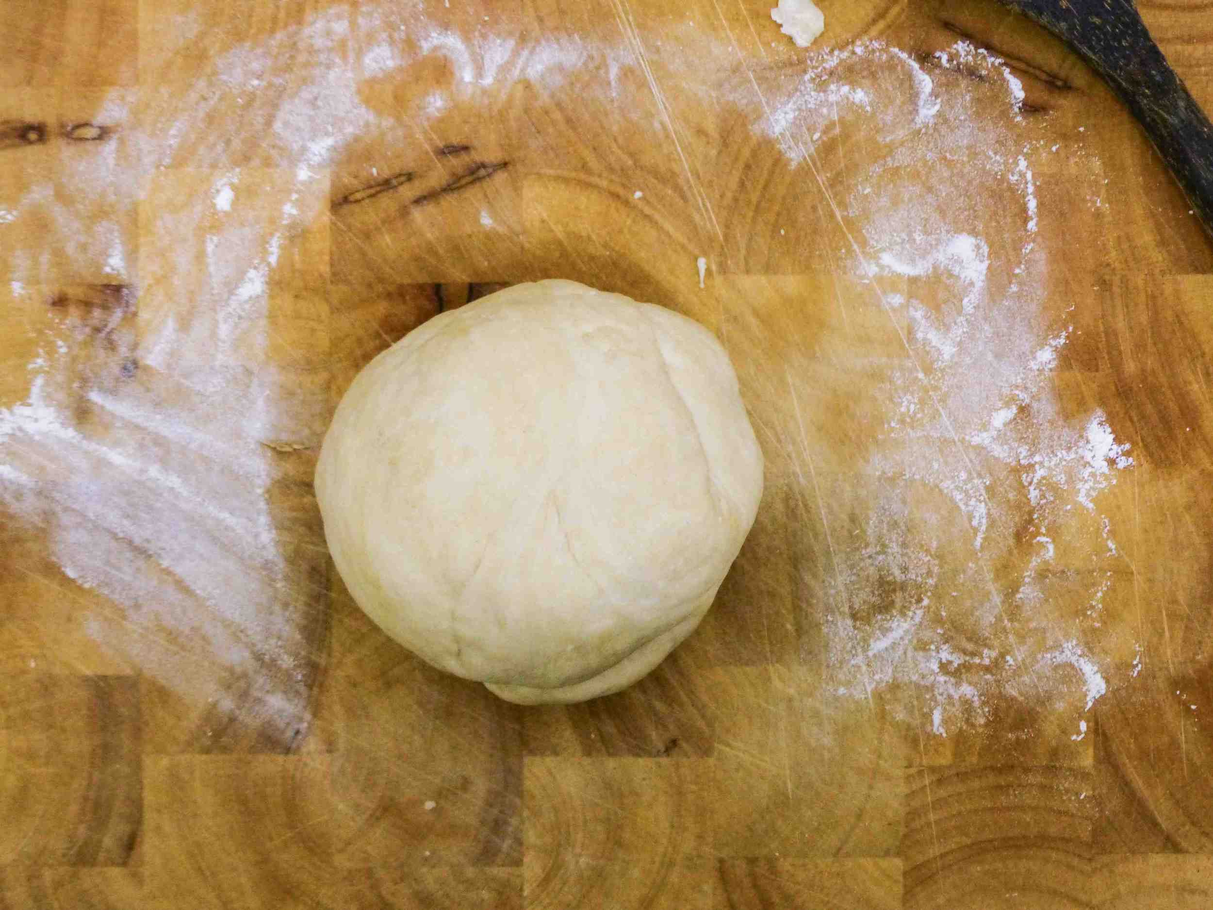 Knead the dough by hands on a lightly floured surface until the dough becomes smooth. 